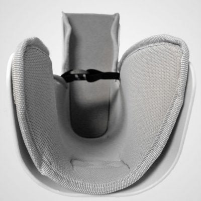Close-up view of a G Stirrups leg positioning device showing the padded interior with a strap for securing the patient's leg during medical procedures.