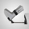 G Stirrups leg positioning device attached to an examination table, showing the adjustable strap and angled positioning for patient support during medical procedures.